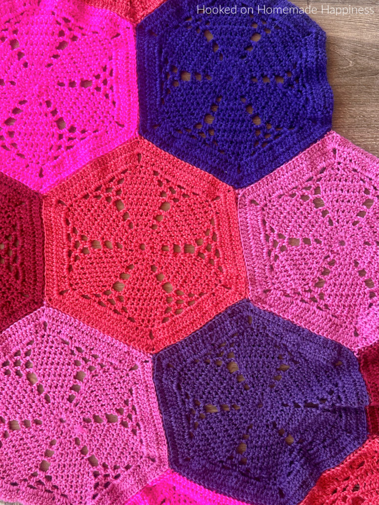 The Blossom Baby Blanket Crochet Pattern is made by sewing these fun and pretty flower hexagons together. Of course, this blanket can easily be made in any size by adding more hexagons.