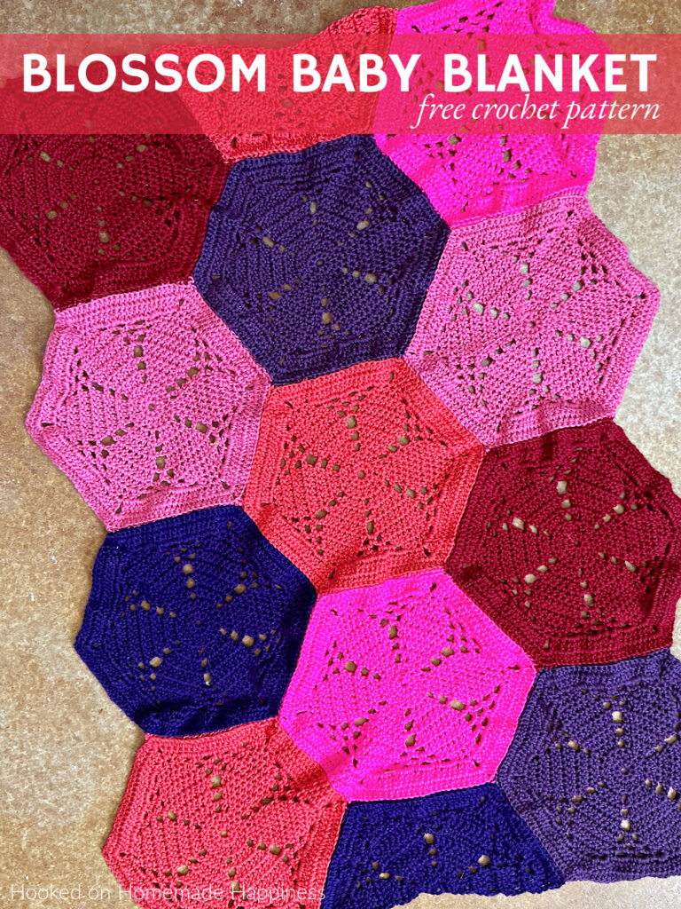 The Blossom Baby Blanket Crochet Pattern is made by sewing these fun and pretty flower hexagons together. Of course, this blanket can easily be made in any size by adding more hexagons.