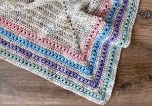 The Spring Shawl Crochet Pattern - I was inspired by our gorgeous weather and pretty pastels to make this Spring Shawl Crochet Pattern. It can be worn over the shoulders like a shawl, or wrapped up like a triangle scarf.