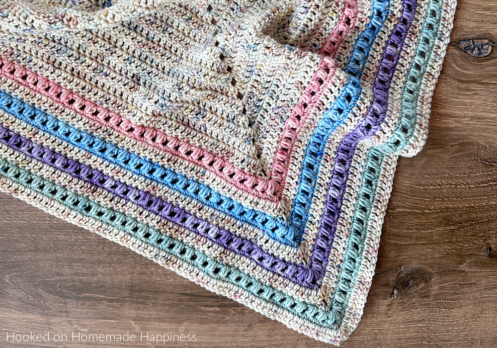The Spring Shawl Crochet Pattern - I was inspired by our gorgeous weather and pretty pastels to make this Spring Shawl Crochet Pattern. It can be worn over the shoulders like a shawl, or wrapped up like a triangle scarf.