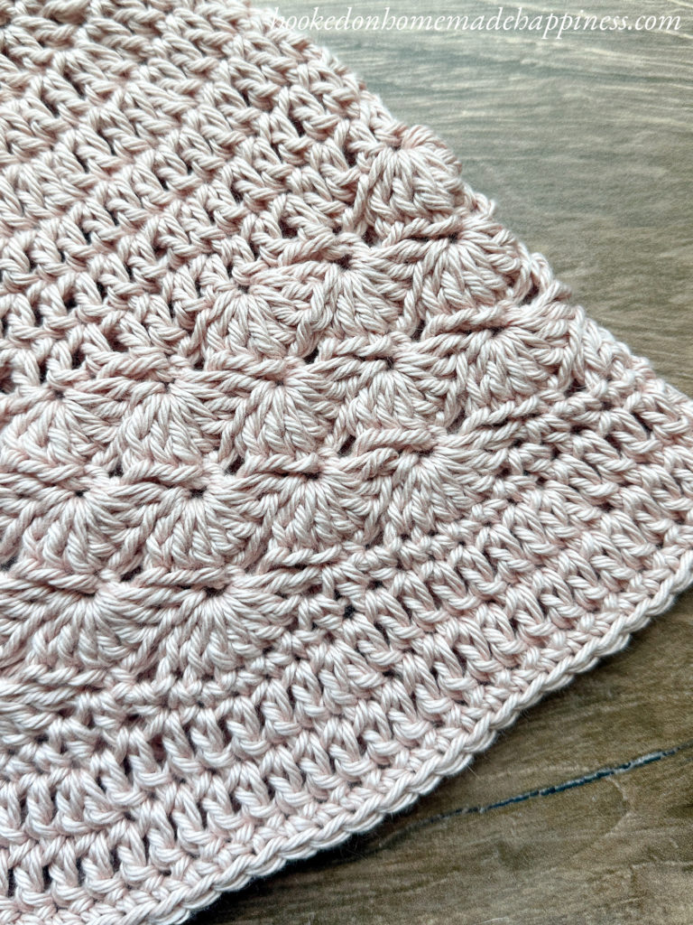 Shell Stitch Bucket Hat Crochet Pattern - The Shell Stitch Bucket Hat Crochet Pattern is a quick, summer hat. It features a simple shell texture above a slightly flared brim.