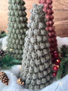 The Bobble Christmas Trees Crochet Pattern comes in 3 sizes and they all easily fit over a styrofoam cone! They are so festive, fun, and perfect for a snowy scene.