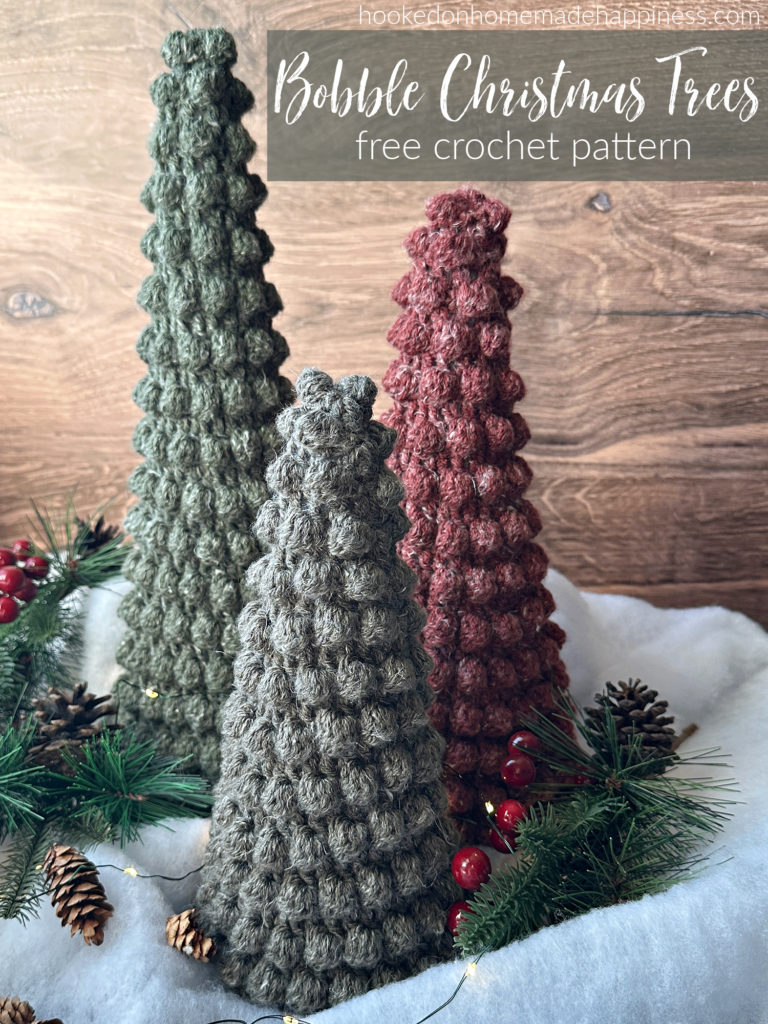 The Bobble Christmas Trees Crochet Pattern comes in 3 sizes and they all easily fit over a styrofoam cone! They are so festive, fun, and perfect for a snowy scene. 