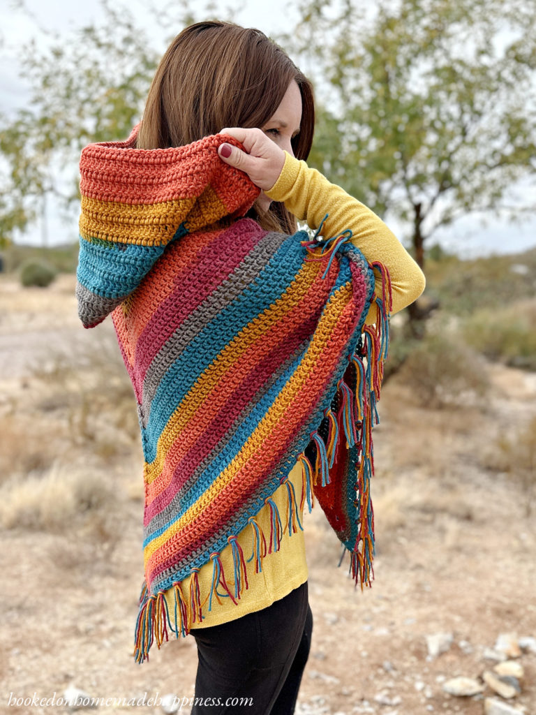 The Easy All Double Crochet Hooded Poncho is a beginner friendly pattern made with all double crochet! I used Caron Big Cakes, which eliminates the ends to weave in and the need to create a color palette. 